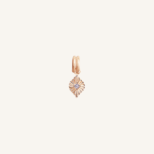 A rose birthstone charm with a purple cubic zirconia representing the month of February.