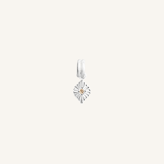 A silver-coloured petite birthstone charm with a citrine cubic zirconia, symbolising October.