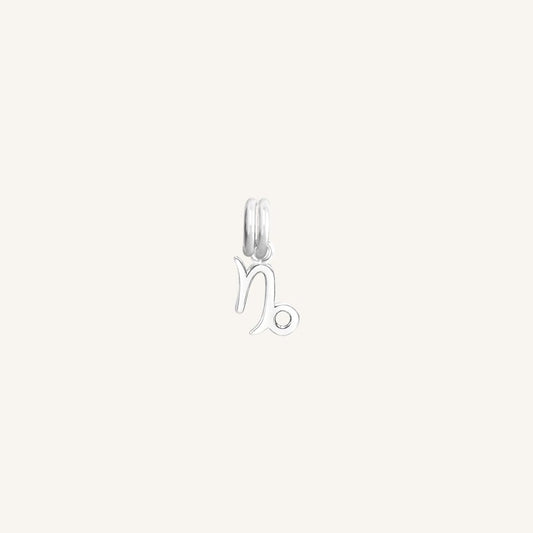 A silver Petite Zodiac Charm representing the Capricorn sign.