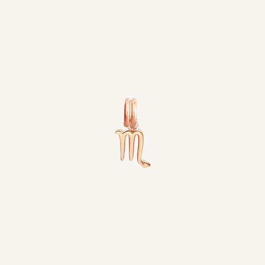 A rose gold-coloured Petite Zodiac Charm representing the Scorpio sign.