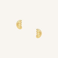 Pair of gold spiral earrings on a white background