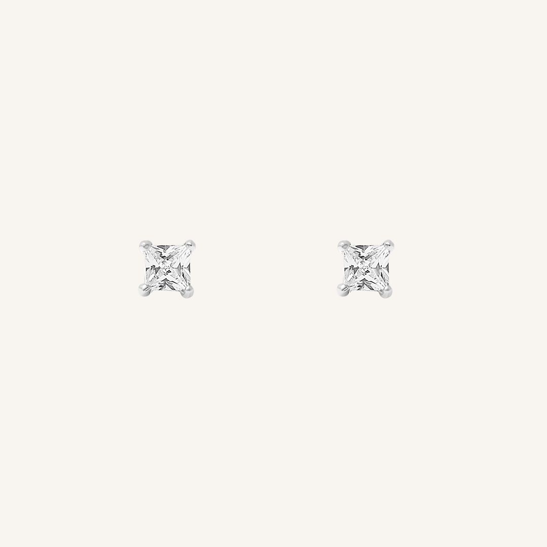 Pair of square cubic zirconia stud earrings on a white background