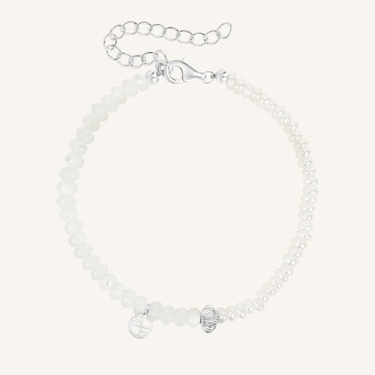 Silver bracelet with beads on a white background