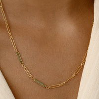 A silver chain necklace with two engraveable panels on a white background