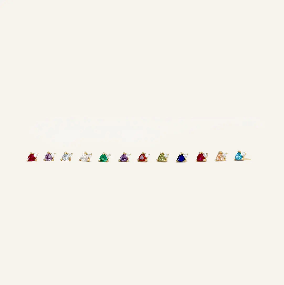 Birthstone studs from January to December lined up 