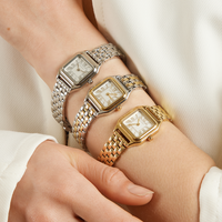 A silver-toned Louis Watch with a link bracelet and a square face featuring Roman numerals.