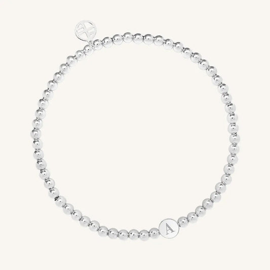 A silver bracelet with a beaded design and an engraveable bead